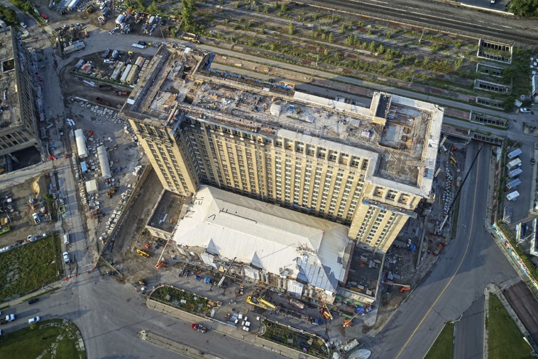 An aerial view of Michigan Central Station and surrounding property, including the former Book Depository (left), under construction in 2020.